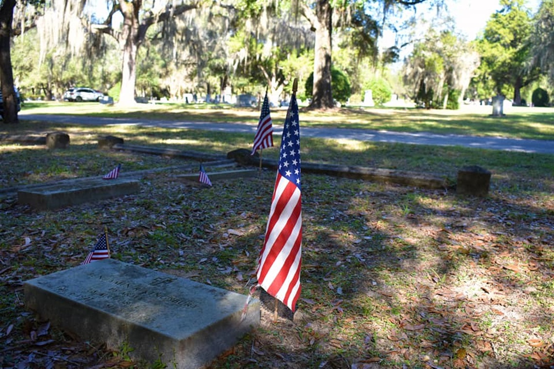 USA flags at the Historic Evergreen Cemetery honor veteran graves
