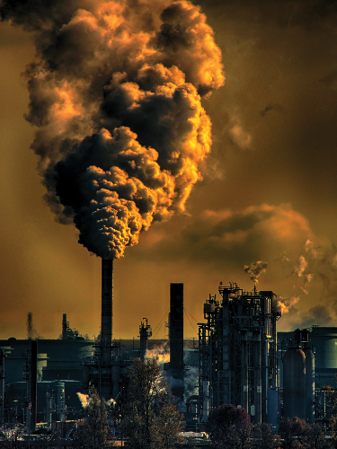 brown smoke coming from an industrial smoke stack