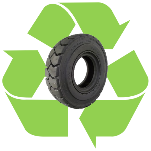 car tire with green recycling loop behind it
