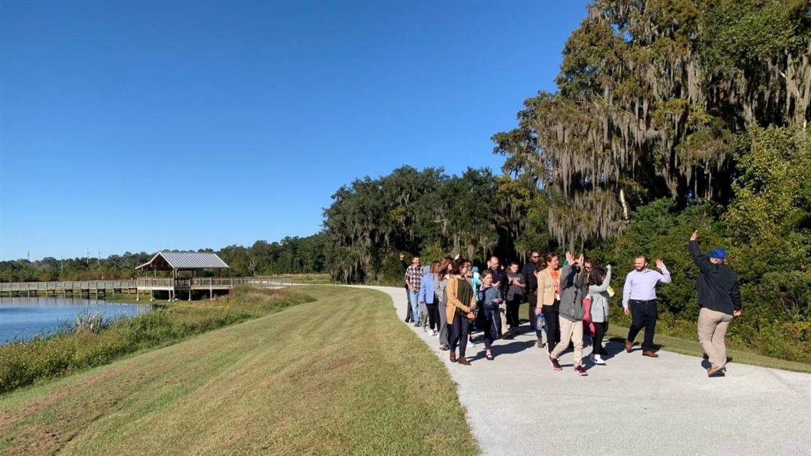 Group walking at Sweetwater Wetlands Park