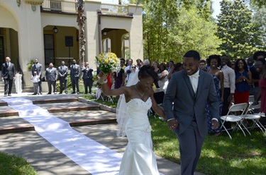 Smiling newly-wed couple