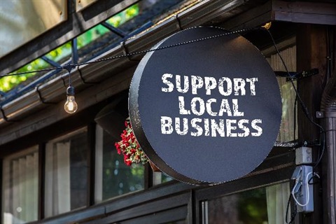 Sign that says support local business
