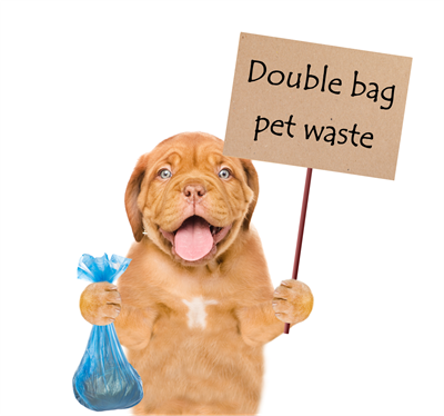 dog holding sign saying double bag pet waste