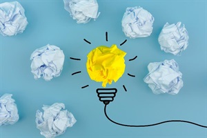 piece of yellow paper made to look like a light bulb