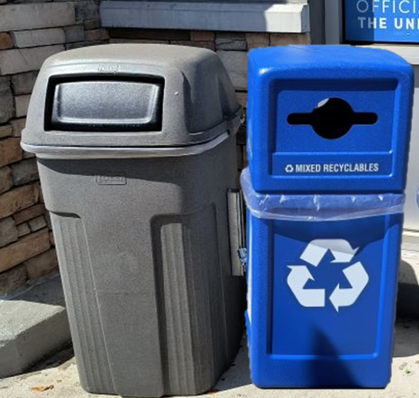 gray garbage bin next blue recycle bin