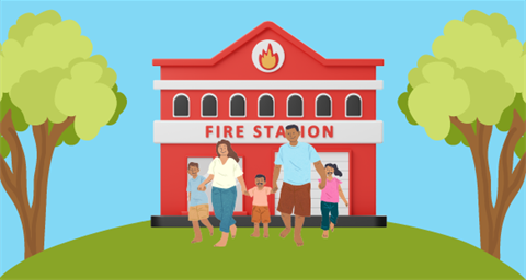 Family in front of fire station